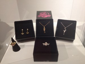 a display of the new sailor moon jewelry, two rings, one set of earrings and two necklaces