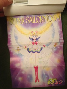 A pull out poster of Super Sailor Moon holding the holy grail and scepter