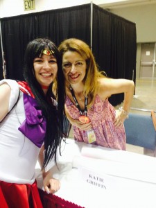 A sailor mars cosplayer stands next to Katie Griffin, voice actress of sailor mars