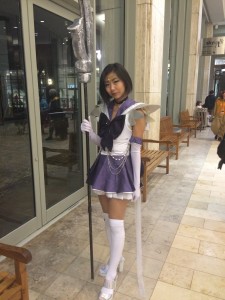 Sailor Saturn stands holding her silent glaive