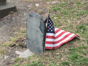 Paul Revere's tombstone with a tiny American flag next to it. 