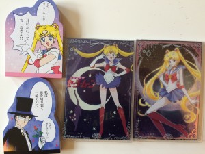 A sailor moon notepad, a tuxedo mask notepad and two packages of sailor moon postcards