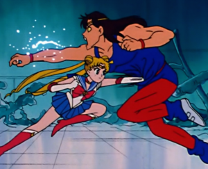 Sailor Moon punches an evil gym monster right in the gut!