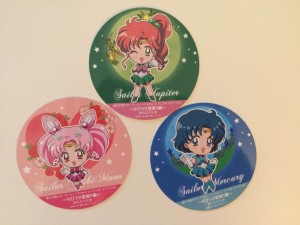 Three paper coasters from the Sailor Moon Cafe--Sailor Chibi Moon, Sailor Jupiter and Sailor Mercury