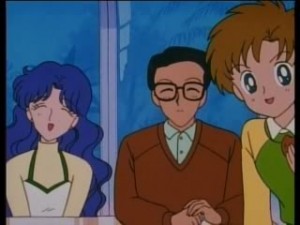 Usagi's Mom, Dad and brother sit at a table.