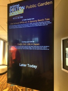 A sign outside the panel room with information about the panel Gaijin Girl