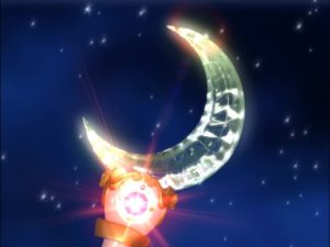 screenshot from the tv show of the Moon Stick with a crystal crescent moon