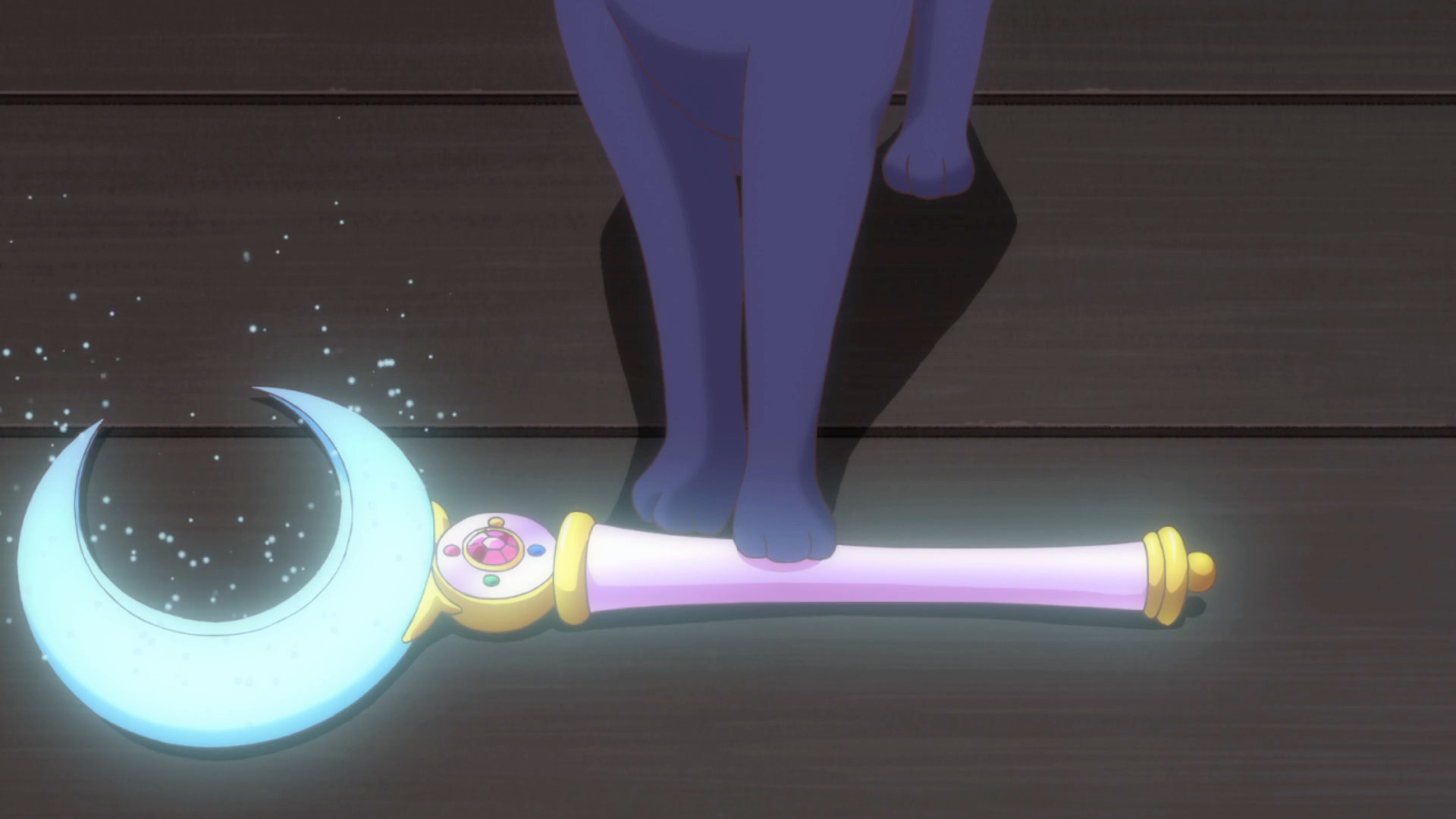 screenshot from sailor moon crystal where Luna presents the moon stick with a glowing moon stick with crystal crescent moon