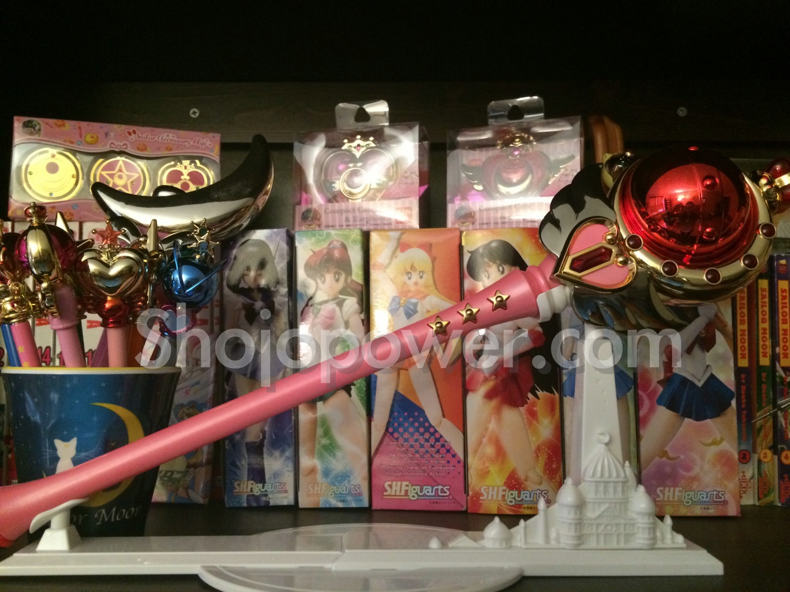 A Sailor Moon merchandise collection with the Cutie Moon rod, pointers and Figuarts